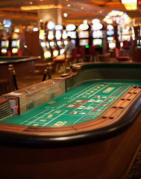 Mobile phone displaying 1xbet apk table games lobby with live roulette and blackjack